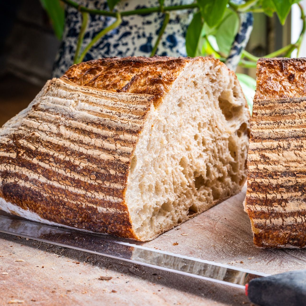 a fresh loaf of sourdough sliced down the middle