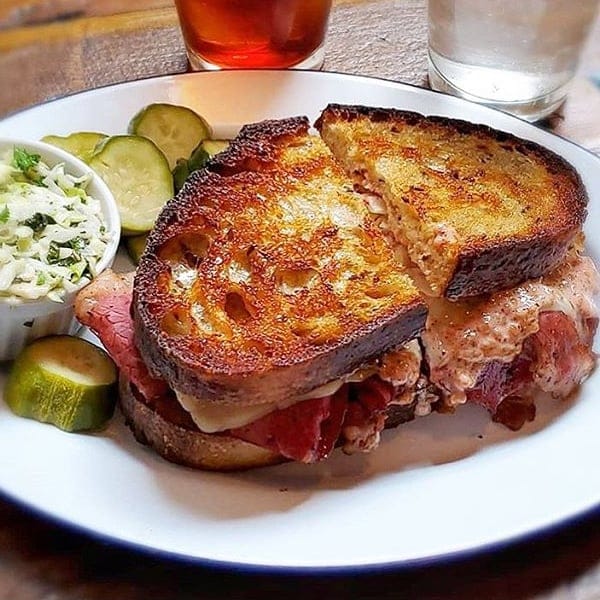 a freshly grilled Reuben sandwich with a golden crust