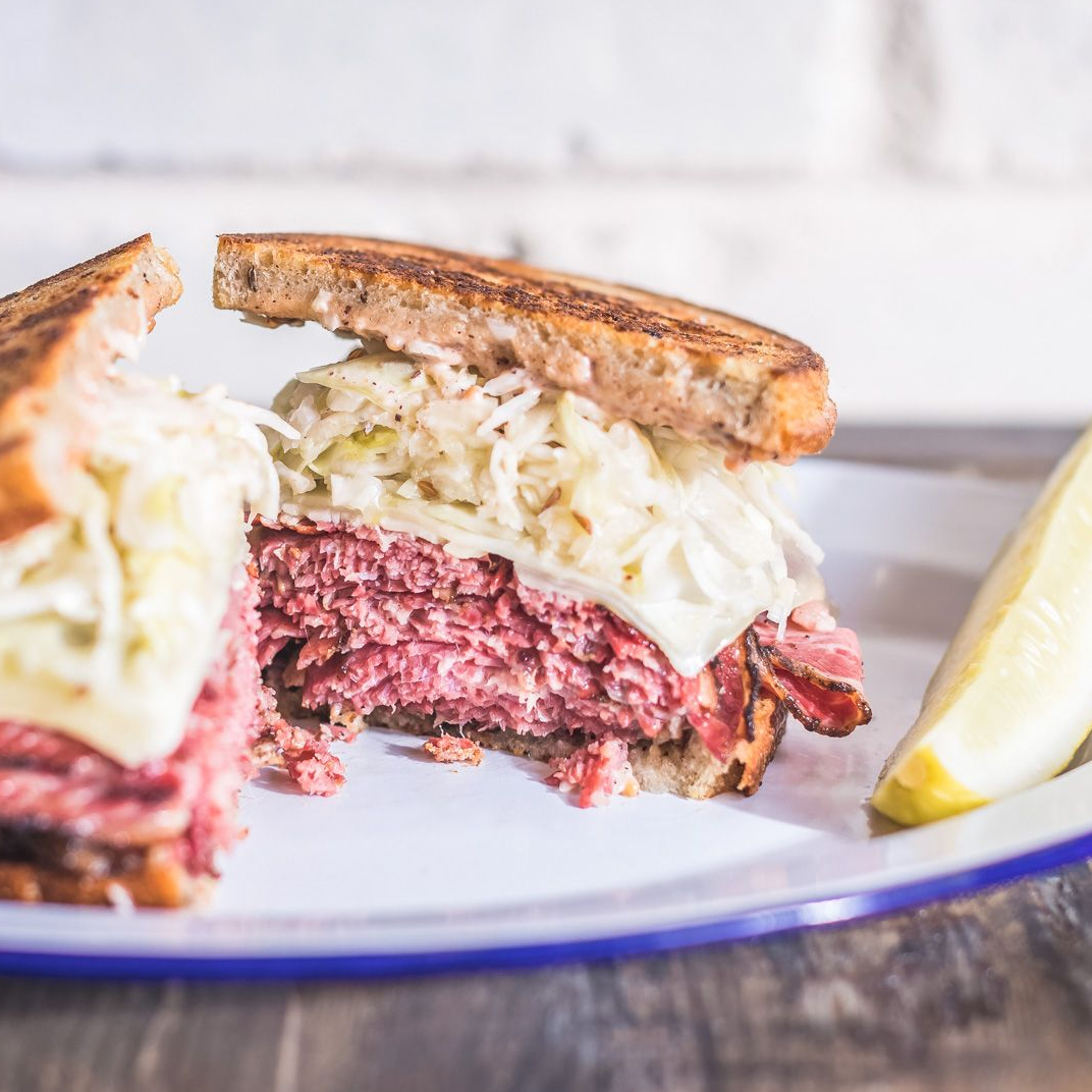 Leven's famous Rueben plated up with a homemade pickle